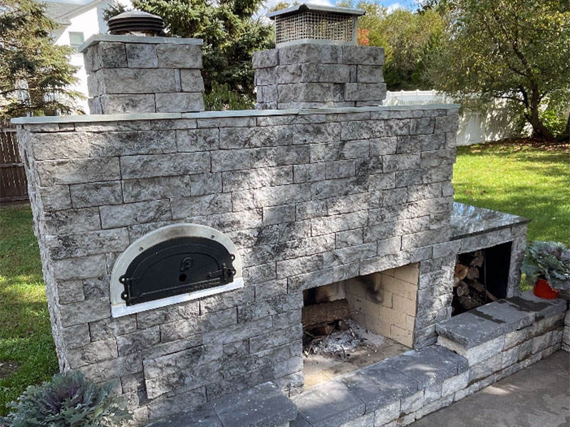 stone veneer sided outdoor pizza oven